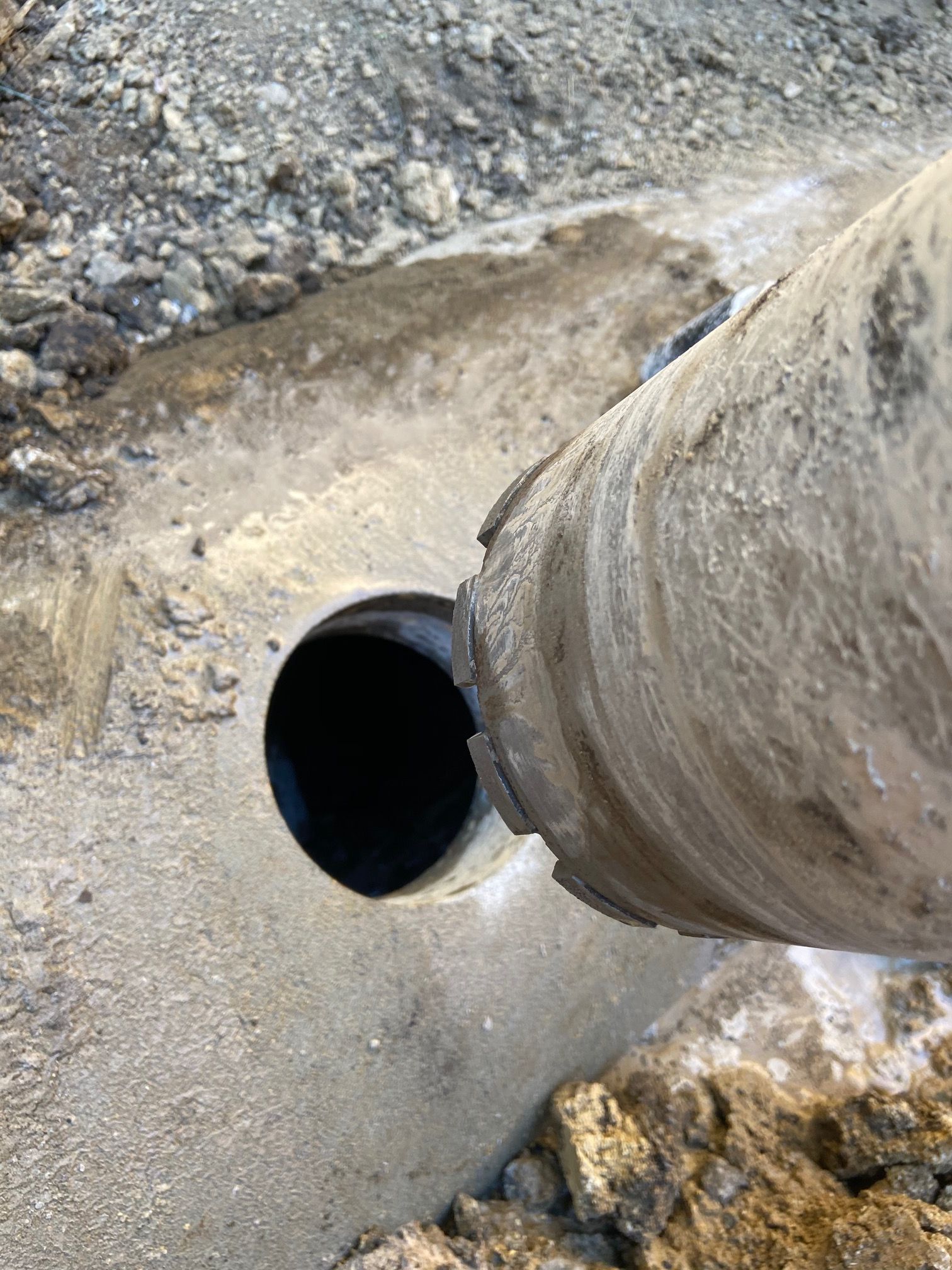 Core drilling rig cutting a precise circular penetration through concrete