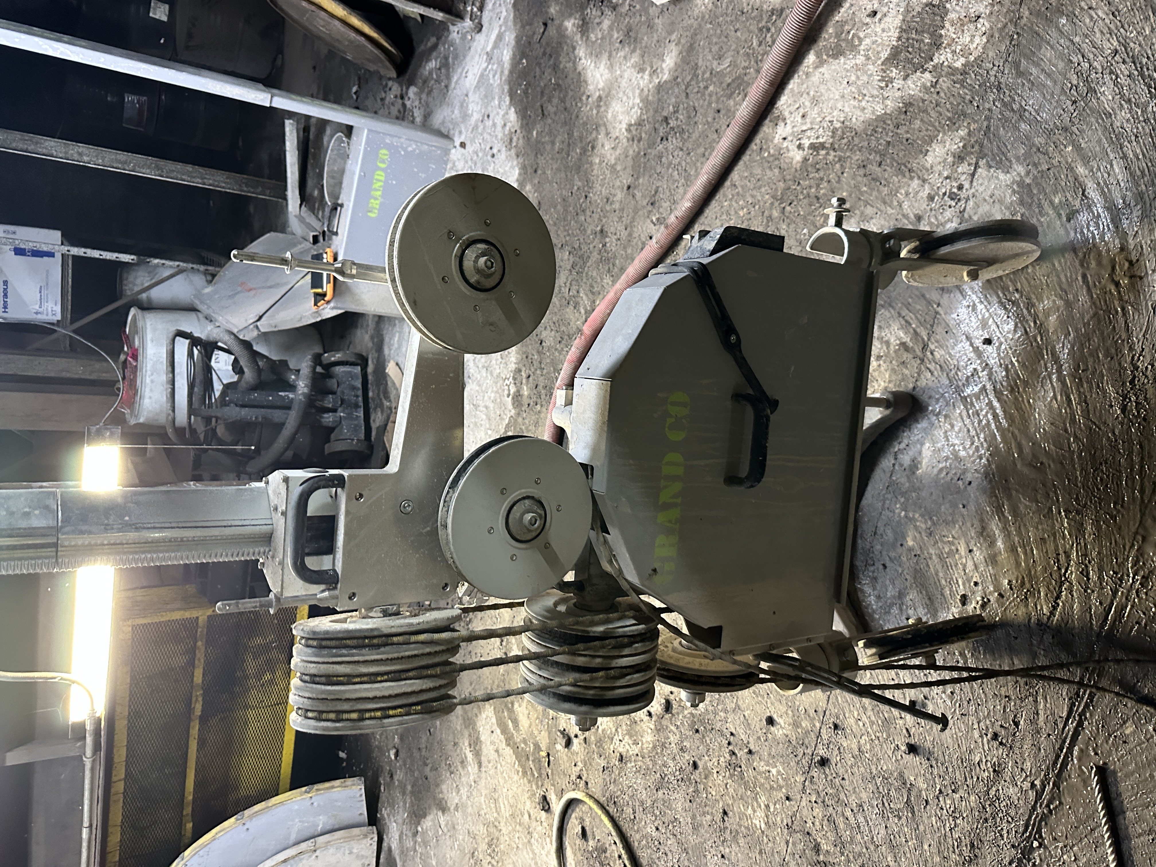 Diamond wire saw cutting through a massive concrete structure